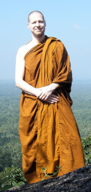 Ajahn Subharo with long-distance view in background, large blue sky